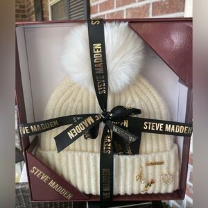 Steve Madden Embellished Beanie in cream white with a faux-fur pom-pom & charms